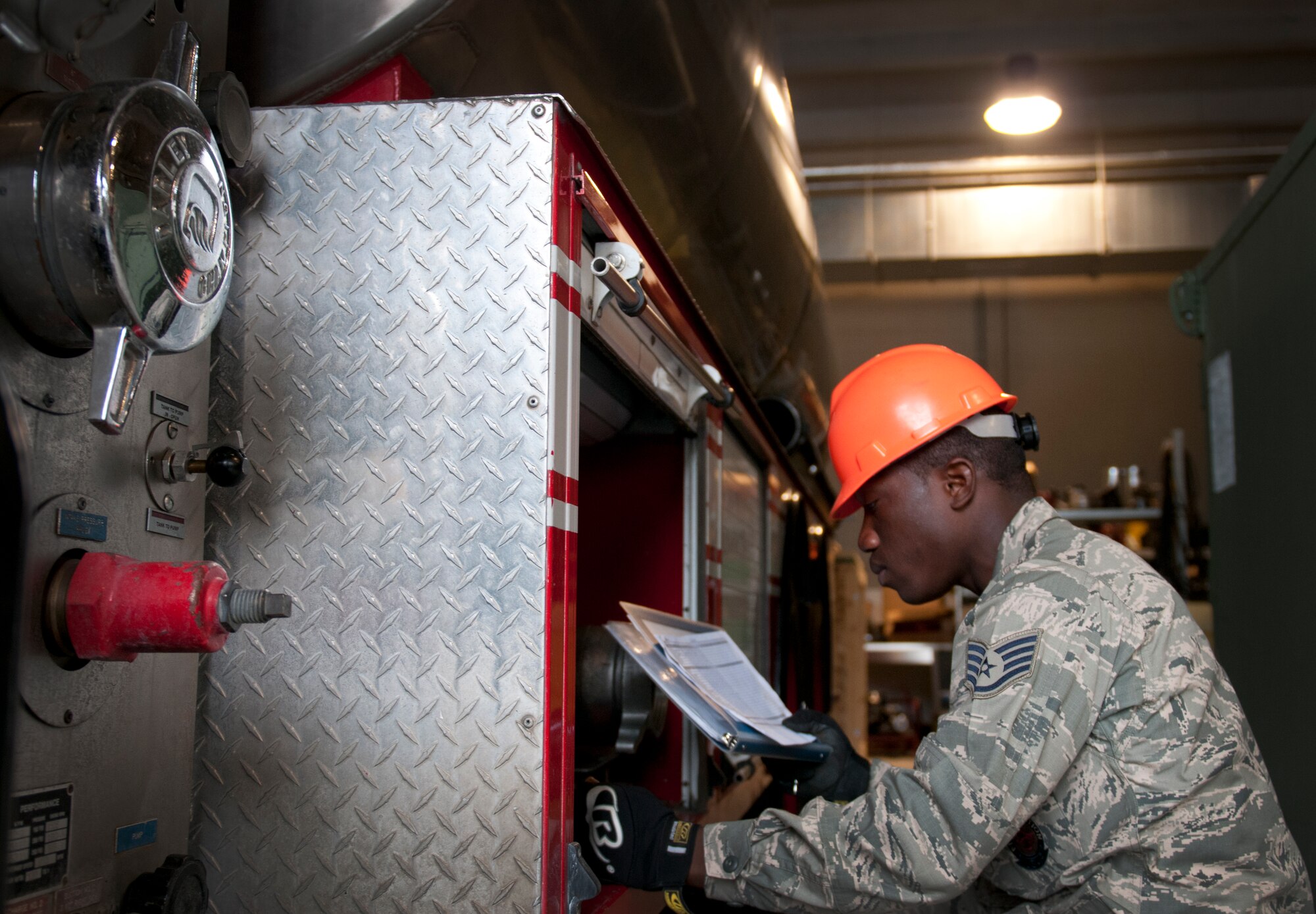 Staff Sgt. Daniel Nembhard, 31st Civil Engineer Squadron firefighter, performs routine checks on a fire engine Sept. 13 at Aviano Air Base, Italy. Firefighters perform daily inspections on all vehicles to ensure they are in working condition and ready to respond in case of an emergency. (U.S. Air Force photo by Senior Airman Katherine Tereyama)