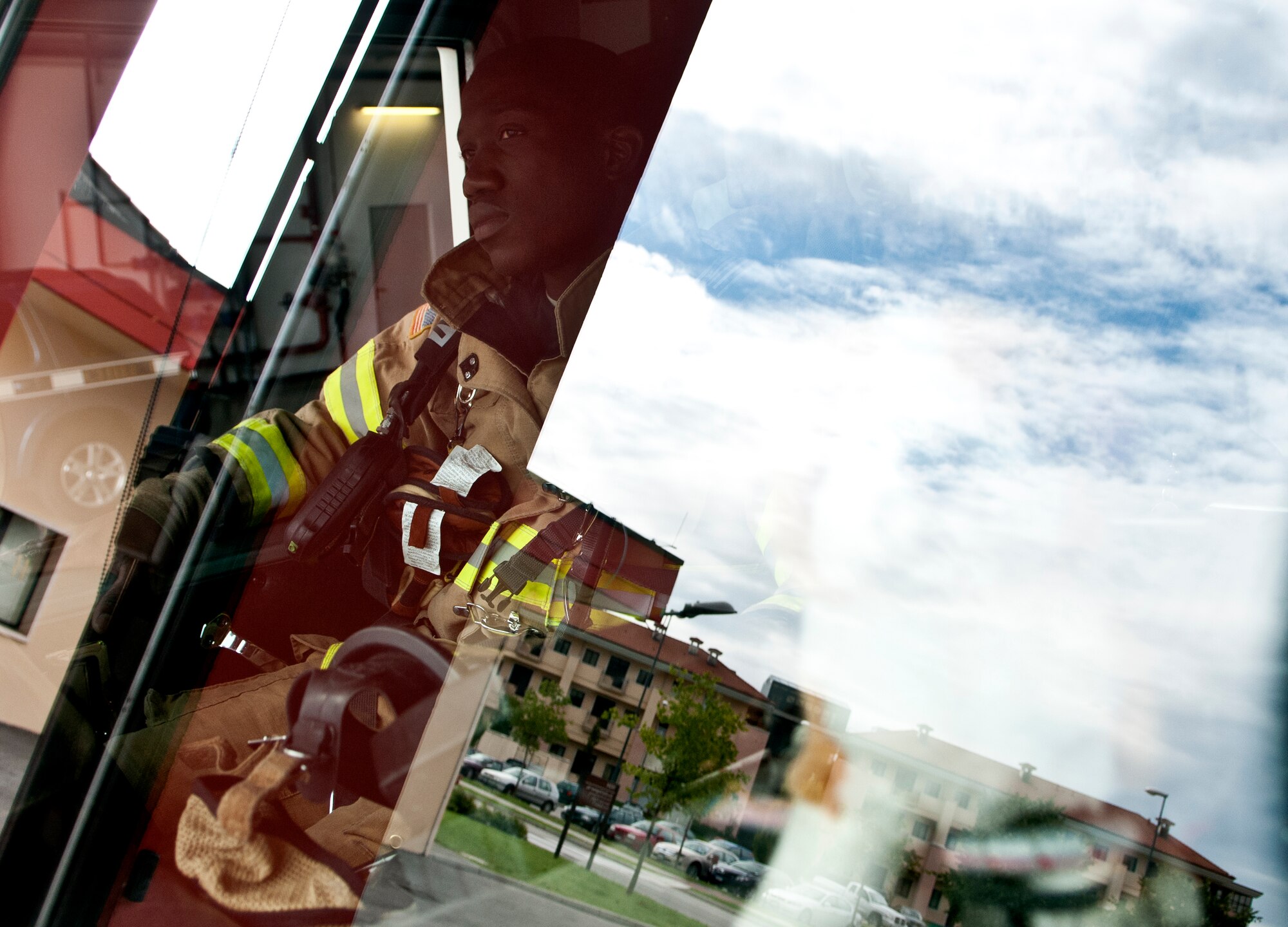 Staff Sgt. Daniel Nembhard, 31st Civil Engineer Squadron firefighter, waits in a fire truck before beginning a training exercise Sept. 13 at Aviano Air Base, Italy. The training exercise was meant to test firefighter’s skills in putting out a fire in a base dormitory building. (U.S. Air Force photo by Senior Katherine Tereyama)