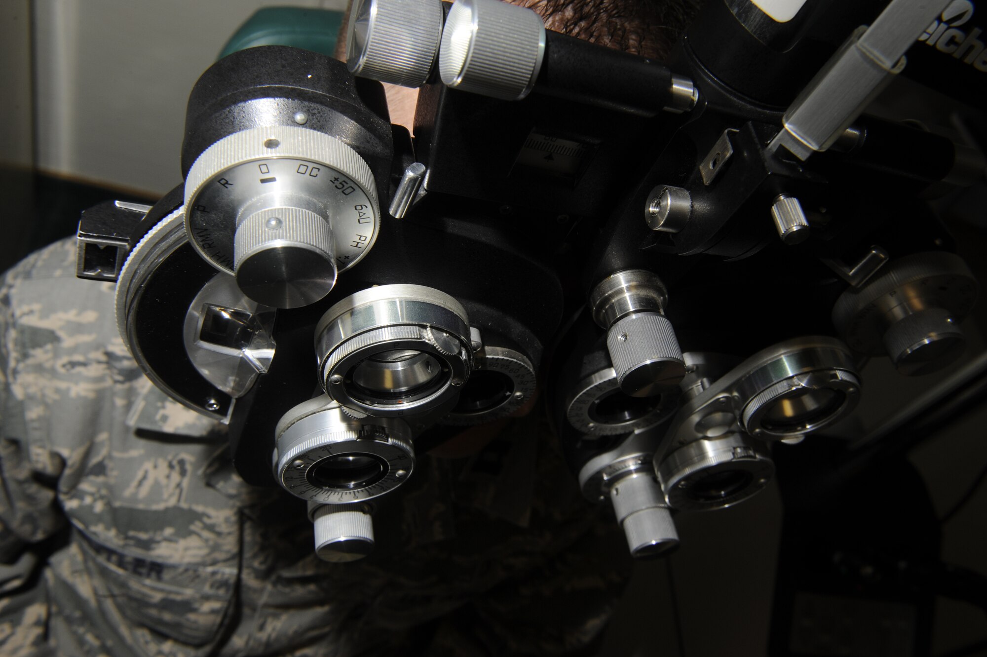 Lt. Col. Judy Rattan, 86th Medical Group optometry flight commander, performs a routine eye exam at the Optometry Clinic, Ramstein Air Base, Germany, Sept. 12, 2012. Members of the Ramstein Optometry Clinic key in on their patient’s needs, ensuring they receive the right care. (U.S. Air Force photo/ Senior Airman Aaron-Forrest Wainwright)