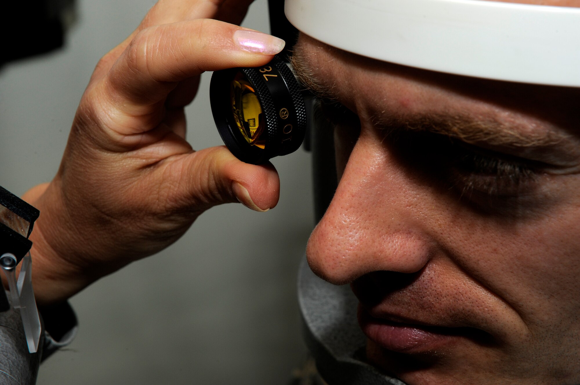 Lt. Col. Judy Rattan, 86th Medical Group optometry flight commander, performs a routine eye exam at the Optometry Clinic, Ramstein Air Base, Germany, Sept. 12, 2012. Members of the Ramstein Optometry Clinic key in on their patient’s needs, ensuring they receive the right care. (U.S. Air Force photo/ Senior Airman Aaron-Forrest Wainwright)