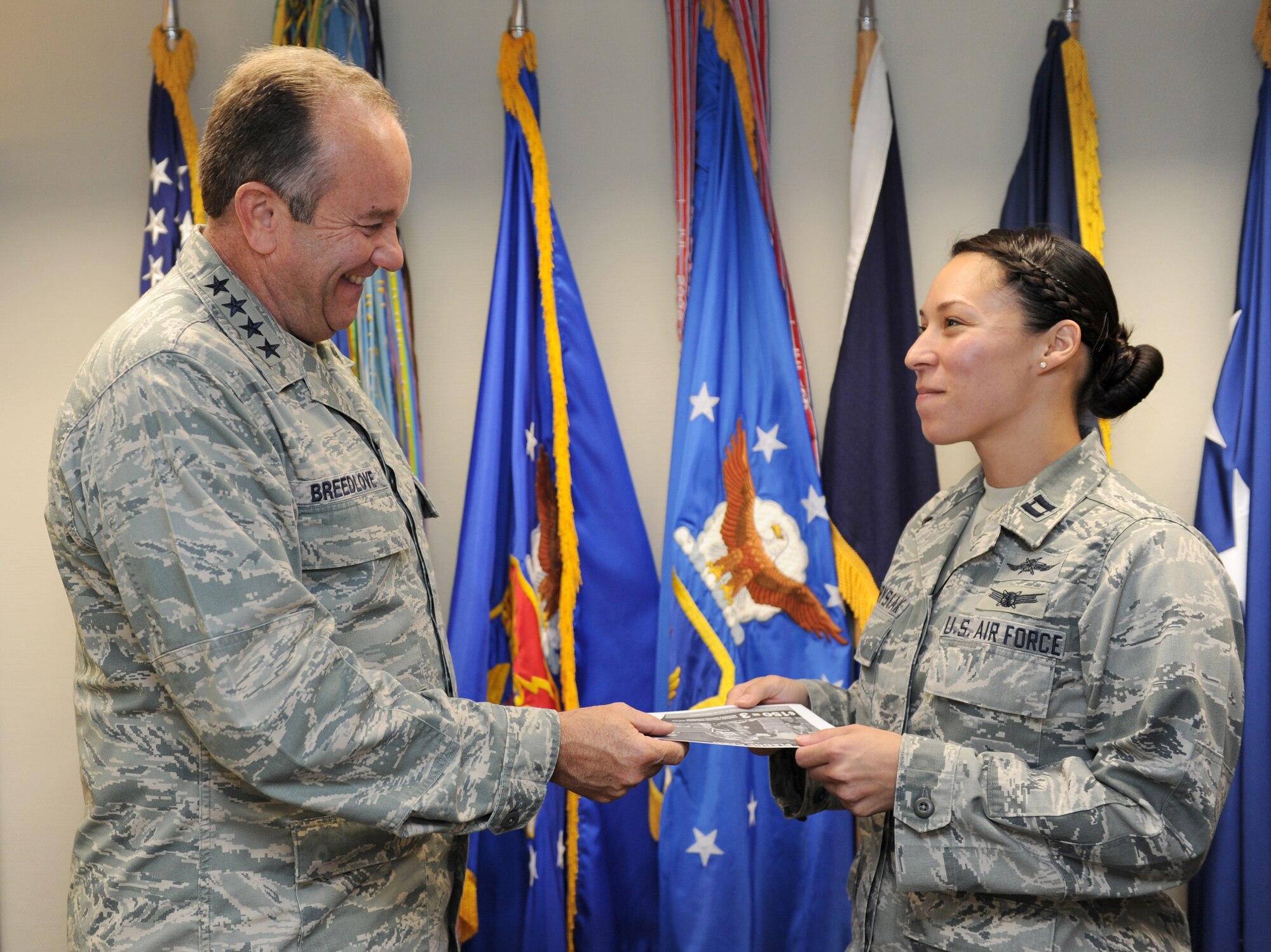 RAMSTEIN AIR BASE, Germany – Gen. Phillip M. Breedlove, U.S. Air Forces in Europe and U.S. Air Forces Africa commander, turns in his Combined Federal Campaign contribution form to Capt. Angelica Hawrysiak, USAFE Headquarters Staff CFC representative. General Breedlove was the first person in USAFE to contribute to the CFC, setting the example for those he leads. The CFC is the world’s most successful annual workplace charity campaign and helps raise money for eligible nonprofit organizations throughout the world. (U.S. Air Force photo/Staff Sgt. Benjamin Wilson)