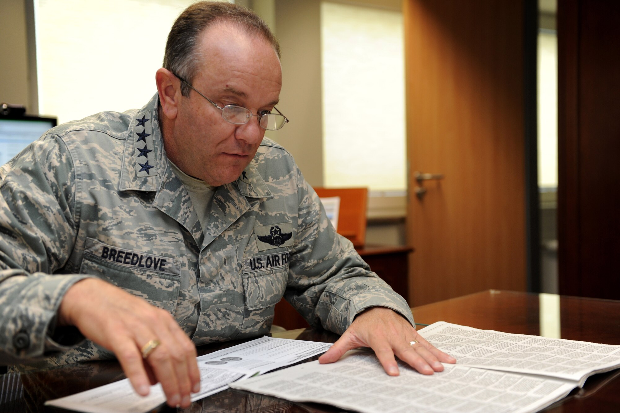 RAMSTEIN AIR BASE, Germany – Gen. Phillip M. Breedlove, U.S. Air Forces in Europe and U.S. Air Forces Africa commander, searches for a charity to donate to in the Combined Federal Campaign charity listing. General Breedlove was the first person in USAFE to contribute to CFC, setting the example for those he leads. The CFC is the world’s most successful annual workplace charity campaign and helps raise money for eligible nonprofit organizations throughout the world. (U.S. Air Force photo/Staff Sgt. Benjamin Wilson)