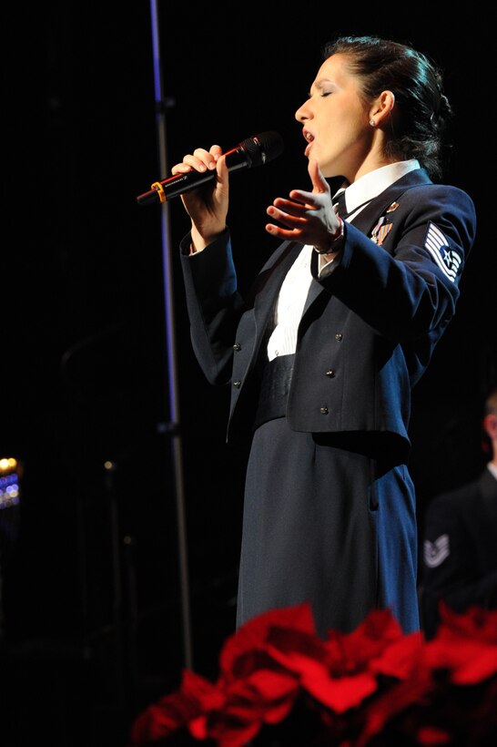 Tech. Sgt. Emily Lewis, a member of The U.S. Air Force Band's Singing Sergeants, performs "All I want for Christmas" at DAR Constitution Hall, Washington, D.C., as part of the 2011 Holiday Concerts. (U.S. Air Force photo by Staff Sgt. Christopher Ruano)
