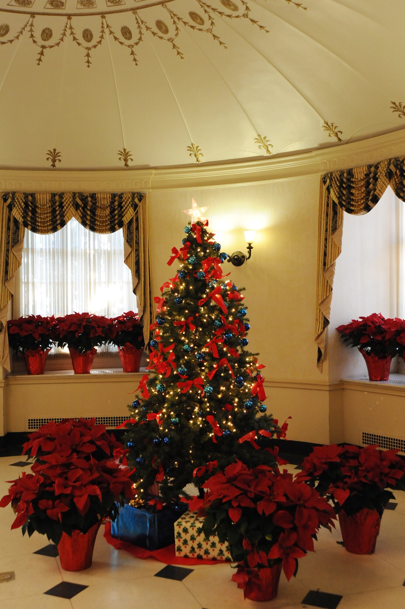 A Christmas tree at the Daughters of the American Revolution Constitution Hall, Washington, D.C., stands surrounded with gifts. The U.S. Air Force Band is ringing in the holidays with the 2012 Holiday Concerts. The free performances are themed "The Spirit of the Season." (U.S. Air Force photo by Staff Sgt. Christopher Ruano)