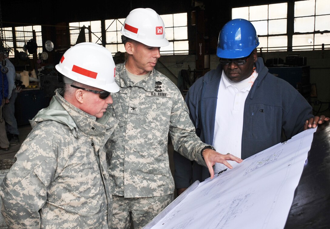Maj. Gen. Merdith W.B. “Bo” Temple (left), former deputy commander of the U.S. Army Corps of Engineers, discusses blueprints for the ladder extension project of the dredge “Hurley” with Col. Tom Smith, commander of Memphis District, and Curtis Pigram, metal worker and welder leader, in the Metal Shop of Ensley Engineer Yard in November 2009.  Temple retired from the U.S. Army Aug. 31, 2012.  (Photo by James Pogue, Memphis District, U.S. Army Corps of Engineers)