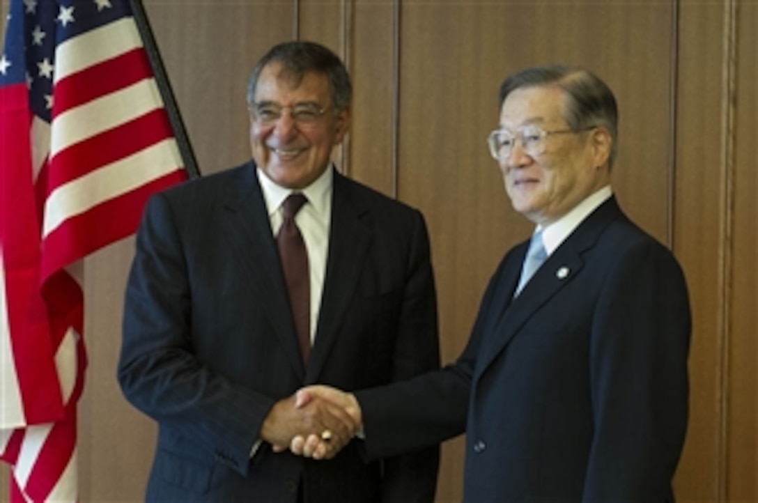 Secretary of Defense Leon E. Panetta, left, shakes hands with Japanese Minister of Defense Satoshi Morimoto in Tokyo, Japan, on Sept. 17, 2012.  Panetta visited Morimoto discuss regional security issues of interest to both nations.  Panetta will visit with defense counterparts in Beijing, China, and Auckland, New Zealand, on a weeklong trip to the Pacific.  
