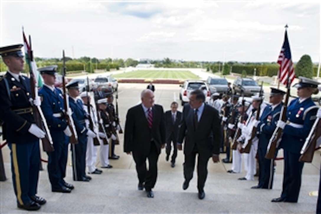 Secretary of Defense Leon E. Panetta, right, escorts Hungarian Minister of Defense Csaba Hende through an honor cordon and into the Pentagon on Sept. 14, 2012. Panetta and Hende will meet to discuss national security items of interest to both nations. 