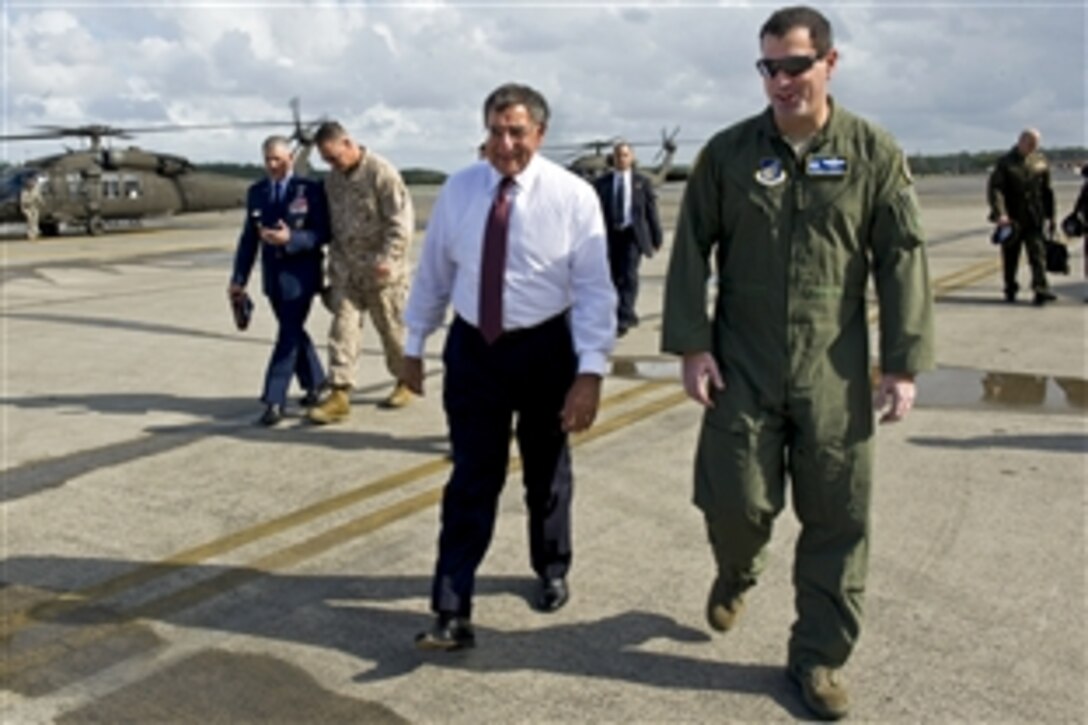 U.S. Defense Secretary Leon E. Panetta walks with U.S. Air Force Col. Mark R. August, commander of the 374th Airlift Wing, on Yakota Air Base, Tokyo, Sept. 17, 2012. Panetta visited with defense counterparts in Tokyo before traveling to Beijing and Auckland, New Zealand, on a weeklong trip to the Asia-Pacific region.
