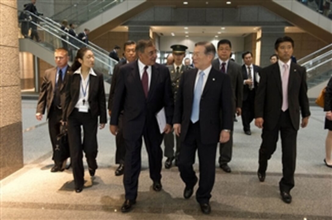 Secretary of Defense Leon E. Panetta, left center, walks with Japanese Minister of Defense Satoshi Morimoto, right center, in Tokyo, Japan, on Sept. 17, 2012.  Panetta visited Morimoto discuss regional security issues of interest to both nations.  Panetta will visit with defense counterparts in Beijing, China, and Auckland, New Zealand, on a weeklong trip to the Pacific.  
