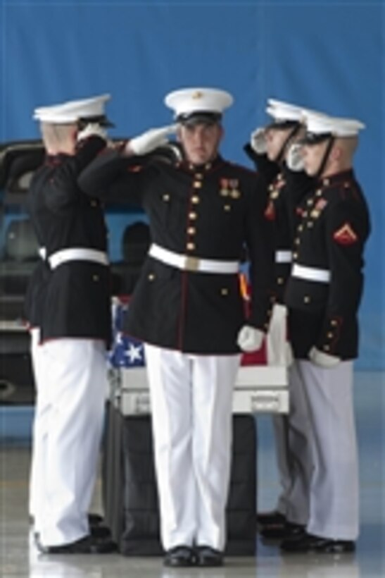 United States Marines salute during the dignified transfer ceremony for the U.S. Ambassador to Libya J. Christopher Stevens, Foreign Service officer Sean Smith, and security officers Tyrone S. Woods and Glen A. Doherty at Joint Base Andrews, Md., on Sept. 14, 2012.  