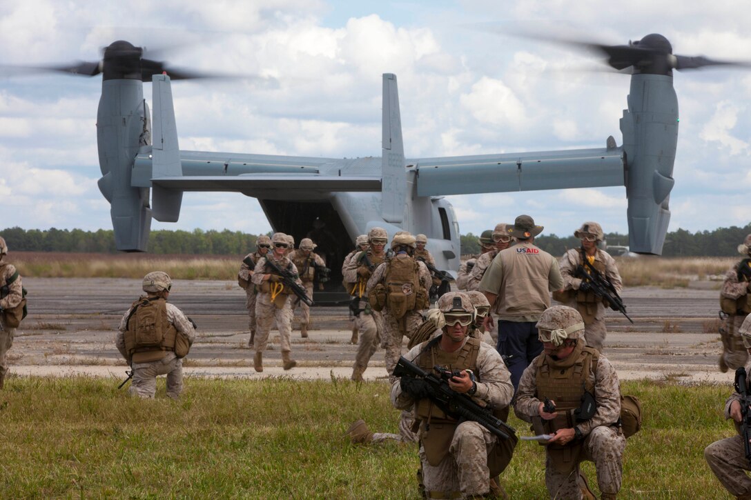 Marines with Combat Logistics Battalion (CLB) 26, 26th Marine Expeditionary Unit (MEU), land in an MV-22B Osprey and set up a perimter during a mass casualty exercise at Fort Pickett, Va., Sept. 14, 2012. A mass casualty is defined as any number of casualties produced in a relatively short period of time that overwhelms the emergency medical services and logistical support. This training is part of the 26th MEU's pre-deployment training program. CLB-26 is one of the three reinforcements of 26th MEU, which is slated to deploy in 2013.