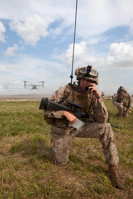 A Marine with Battalion Landing Team (BLT) 3/2, 26th Marine Expeditionary Unit (MEU), talks on a radio during a mass casualty training exercise at Fort Pickett, Va., Sept. 14, 2012. A mass casualty is defined as any number of casualties produced in a relatively short period of time that overwhelms the emergency medical services and logistical support. This training is part of the 26th MEU's pre-deployment training program. BLT 3/2 is one of the three reinforcements of 26th MEU, which is slated to deploy in 2013.