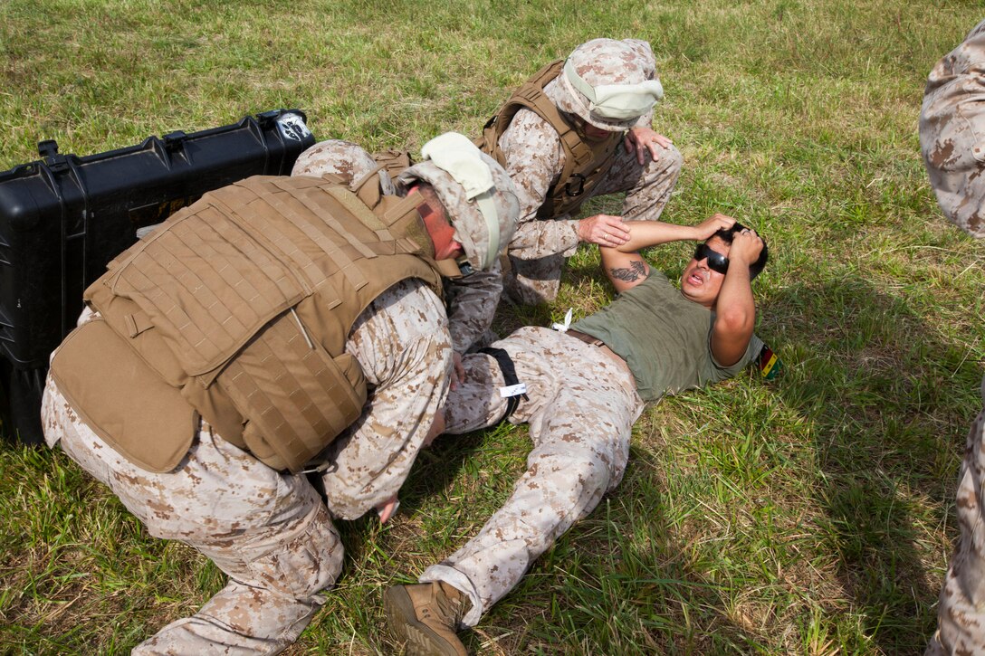 Marines with Battalion Landing Team 3/2, 26th Marine Expeditionary Unit, treat a simulated casualty during a mass casualty exercise at Fort Pickett, Va., Sept. 14, 2012. A mass casualty is defined as any number of casualties produced in a relatively short period of time that overwhelms the emergency medical services and logistical support. This training is part of the 26th MEU's pre-deployment training program. BLT 3/2 is one of the three reinforcements of 26th MEU, which is slated to deploy in 2013.