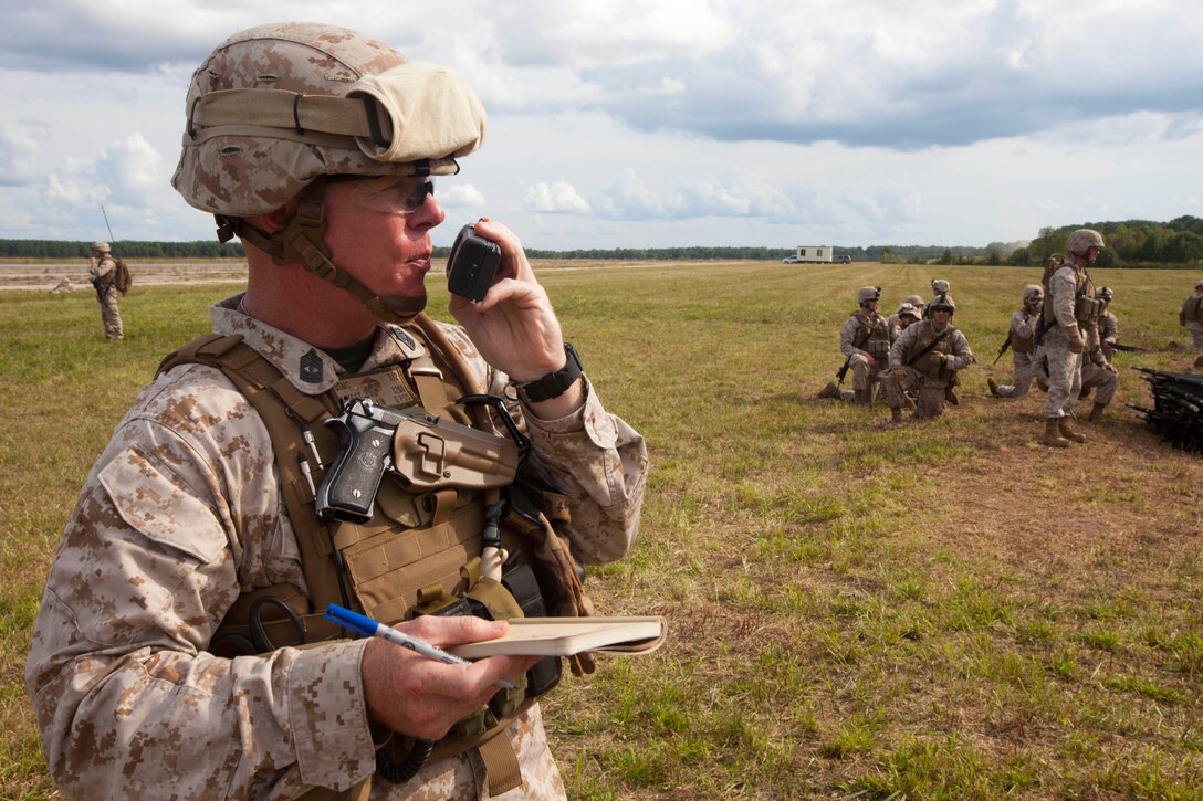 A Marine with Battalion Landing Team 3/2, 26th Marine Expeditionary Unit, talks on a radio during a mass casualty training exercise at Fort Pickett, Va., Sept. 14, 2012. A mass casualty is defined as any number of casualties produced in a relatively short period of time that overwhelms the emergency medical services and logistical support. This training is part of the 26th MEU's pre-deployment training program. BLT 3/2 is one of the three reinforcements of 26th MEU, which is slated to deploy in 2013.