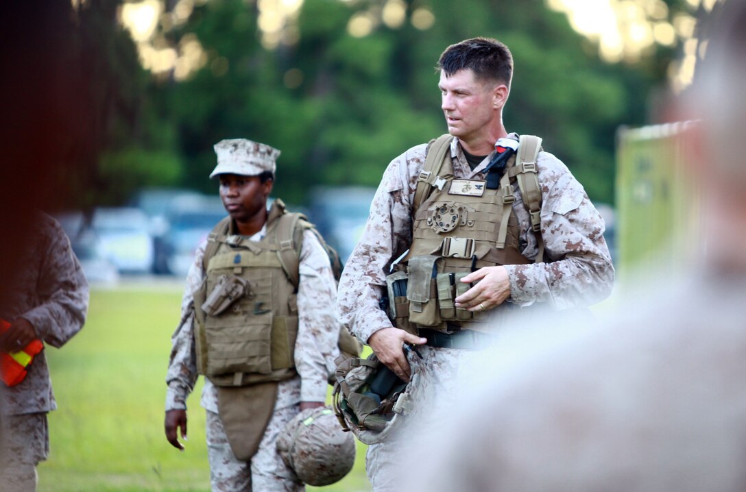 Col. Mark R. Hollahan, the commanding officer for Combat Logistics Regiment 27, 2nd Marine Logistics Group, speaks with Marines and sailors after a six-mile hike aboard Camp Lejeune, N.C., Sept. 13, 2012. Headquarters Company, CLR-27 tested its troops’ endurance, along with their mental and physical strength during a hike early in the morning. 