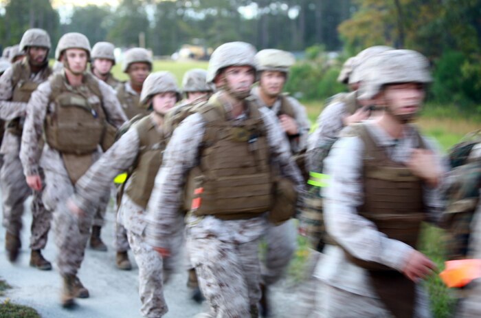 Marines with Headquarters Company, Combat Logistics Regiment 27 move rapidly during a six-mile hike aboard Camp Lejeune, N.C., Sept. 13, 2012. Marines and sailors were put to the test physically and mentally during a six-mile trek through the French Creek area of the base.