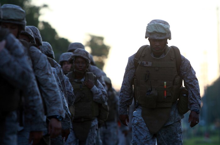 Gunnery Sgt. Dewan M. Britton, the company gunnery sergeant for Headquarters Company, Combat Logistics Regiment 27, marches along the company’s formation during a hike aboard Camp Lejeune, N.C., Sept. 13, 2012. Marines and sailors were put to the test physically and mentally during a six-mile trek through the French Creek area of the base. 