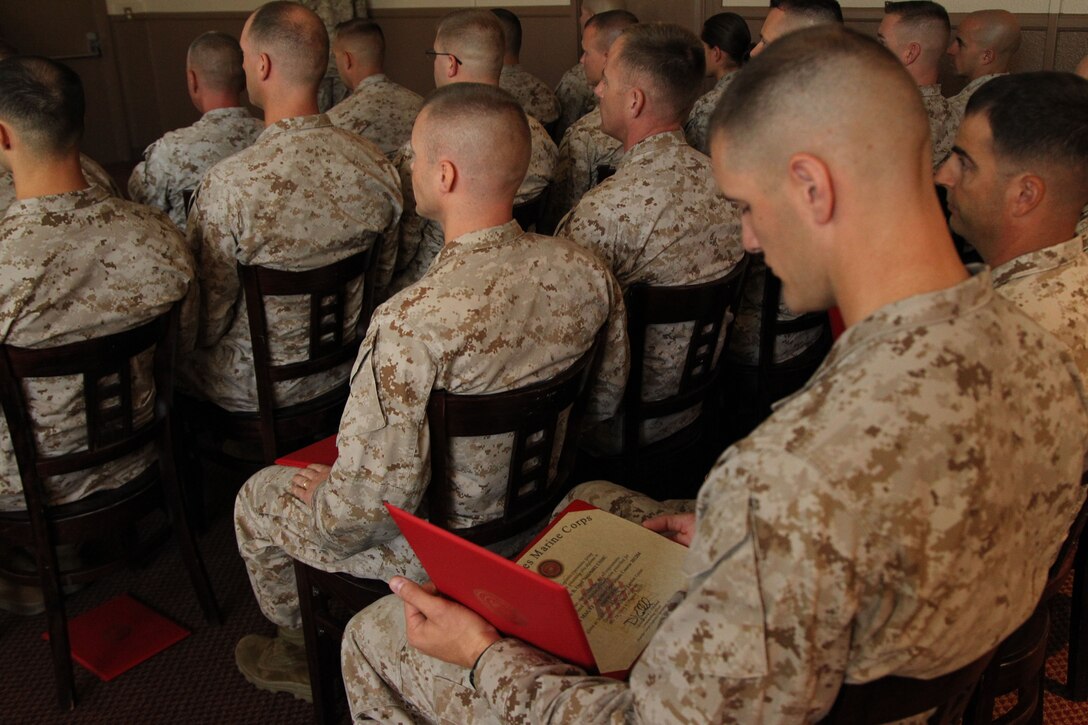 Capt. Kyle Opel, student, Intermediate Marine Air Ground Task Force Logistics Operations Course 4-12, looks at his completion certificate during the class’ graduation ceremony at the Combat Centers’ Officer’s Club Aug 31, 2012.