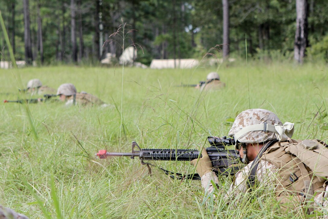 Marines from Headquarters Company, 8th Marine Regiment, 2nd Marine Division, secure a landing zone Sept. 12 during a regimental field exercise aboard Marine Corps Base Camp Lejeune.(U.S. Marine Corps photo by Sgt. Steve Cushman)