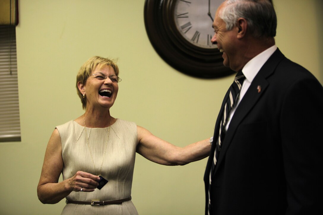 Mona Padrick, the president of the Onslow County Chamber of Commerce, laughs during the celebration for her upcoming retirement. Padrick has served the Chamber of Commerce for 16 years.