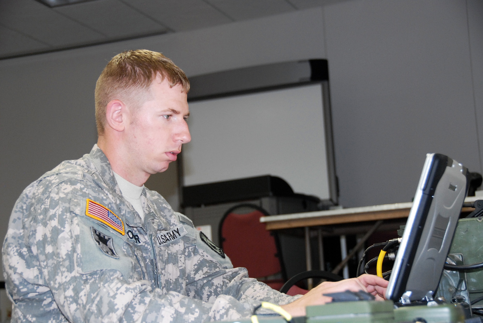 Staff Sgt. Andrew Wagoner, 724th Engineer Batallion, relays critical mission information between the Tactical Operations Center and Quick Reaction Force units in the field. The scenario was part of PATRIOT 12, a National Guard domestic response exercise that included both military and civilian agencies. Wisconsin National Guard photo by Sgt. Robert Waight 