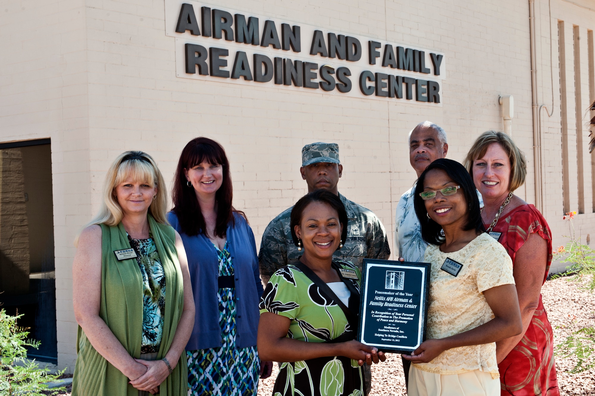 The 99th Force Support Squadron Airman and Family Readiness Center staff pose for a group photo after winning the Mediators of Southern Nevada, Peacemaker of the Year Award Sept. 17, 2012, at Nellis Air Force Base, Nev. The Mediators of Southern Nevada was founded in 1992 and is an organization dedicated to the education, promotion, and support of alternative dispute resolution processes. From left to right are, Michele Dresel, AFRC director, Daphne Ames, AFRC discovery resource center coordinator, Master Sgt. Kevin Johnson, AFRC superintendent, Leonard Boddie, AFRC chief, Ellen Reynolds, AFRC community readiness consultant, Stephanie Garnes, AFRC exceptional family member coordinator, and Brenda Jarvis, AFRC community resource consultant  (U.S. Air Force photo by Airman 1st Class Jason Couillard)
