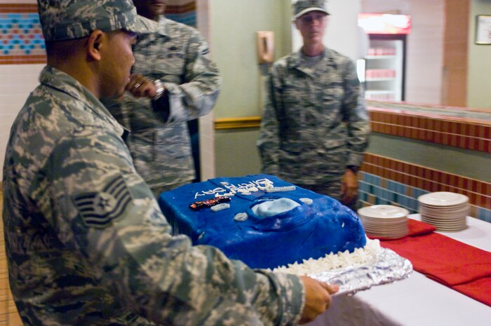 99th Force Support Squadron Airmen present a specially designed birthday cake celebrating the United States Air Force's 65th birthday on Sept. 18, 2012 at the Cross Winds Dining Facility on Nellis Air Force Base, Nev. The Cross Winds Dining Facility designed a special lunch for Airmen to celebrate the USAF's 65th birthday complete with a birthday cake for dessert. (U.S. Air Force photo by Senior Airman Jack Sanders)