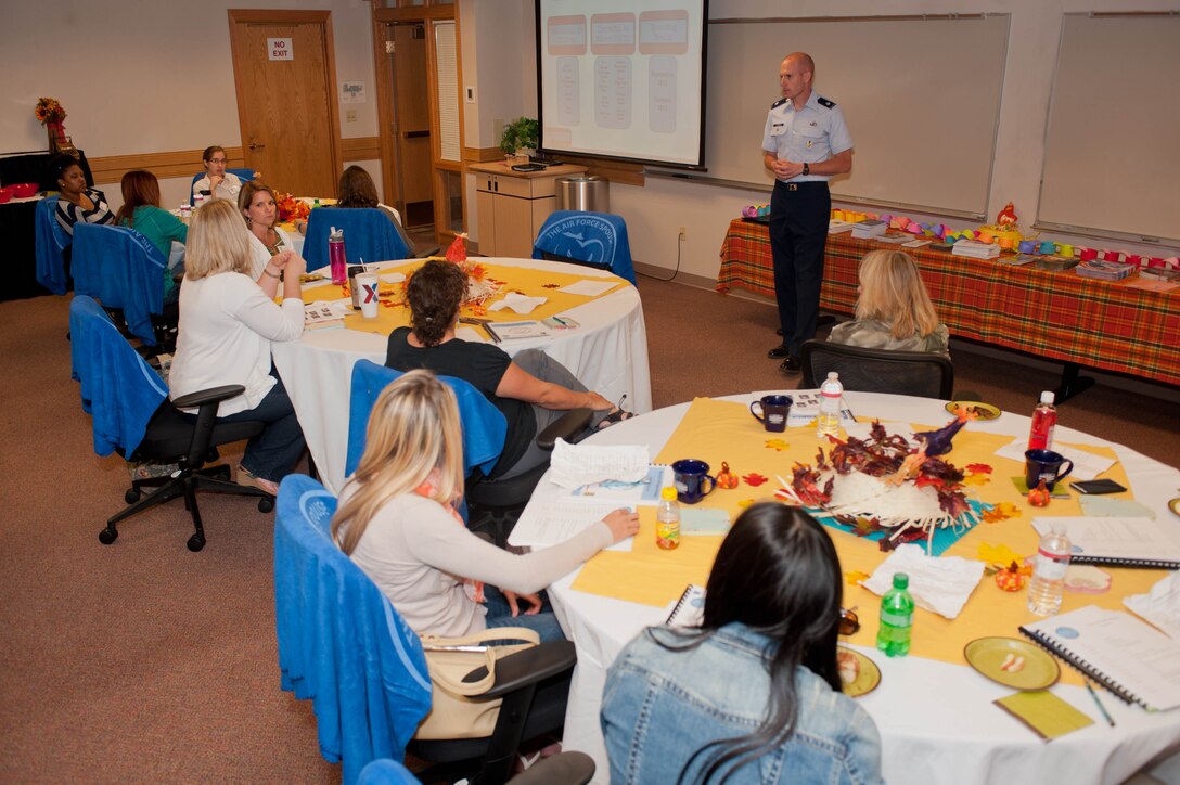 Lt. Col. Michael Petrocco, 28th Mission Support Group deputy commander, delivers a presentation and answers questions to spouses unfamiliar with the Air Force lifestyle during a Heart Link orientation brief at Ellsworth Air Force Base, S.D., Sept. 17, 2012. Heart Link is a quarterly program established by wing leadership to introduce new spouses to the base and help them feel more at home in a new surrounding, and provide information to the many community resources available to Ellsworth families. (U.S. Air Force photo by Airman 1st Class Zachary Hada/Released)