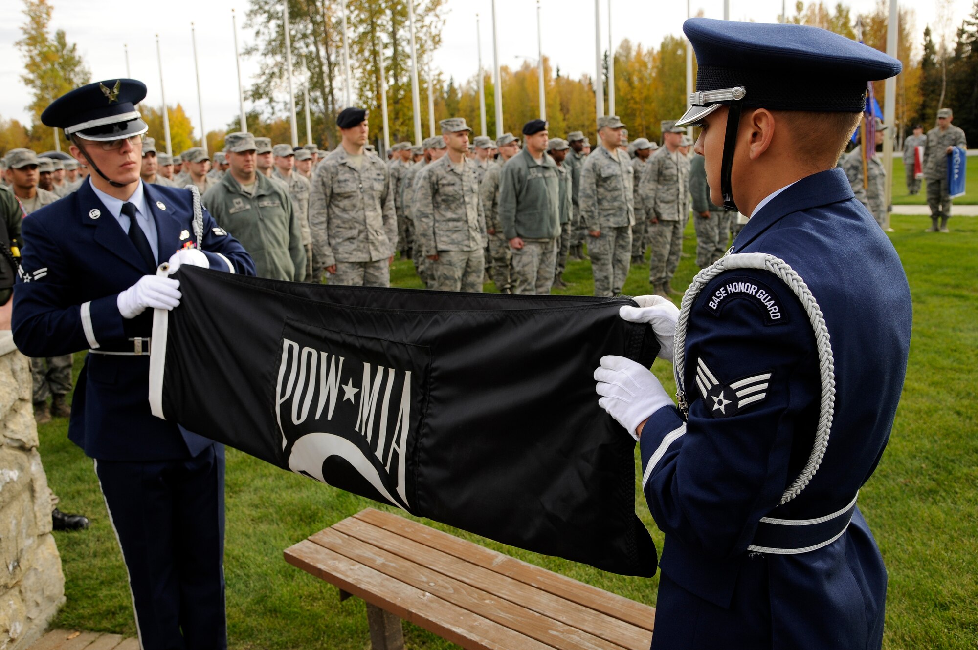 Eielson Air Force Base honor guard members fold the prisoner of war/missing in action flag during the POW/MIA retreat ceremony Sept. 14, 2012, Eielson AFB, Alaska. The POW/MIA retreat ceremony commemorates the men and women of the armed forces who have given immense sacrifices while in military service. (U.S. Air Force photo/Staff Sgt. Jim Araos)