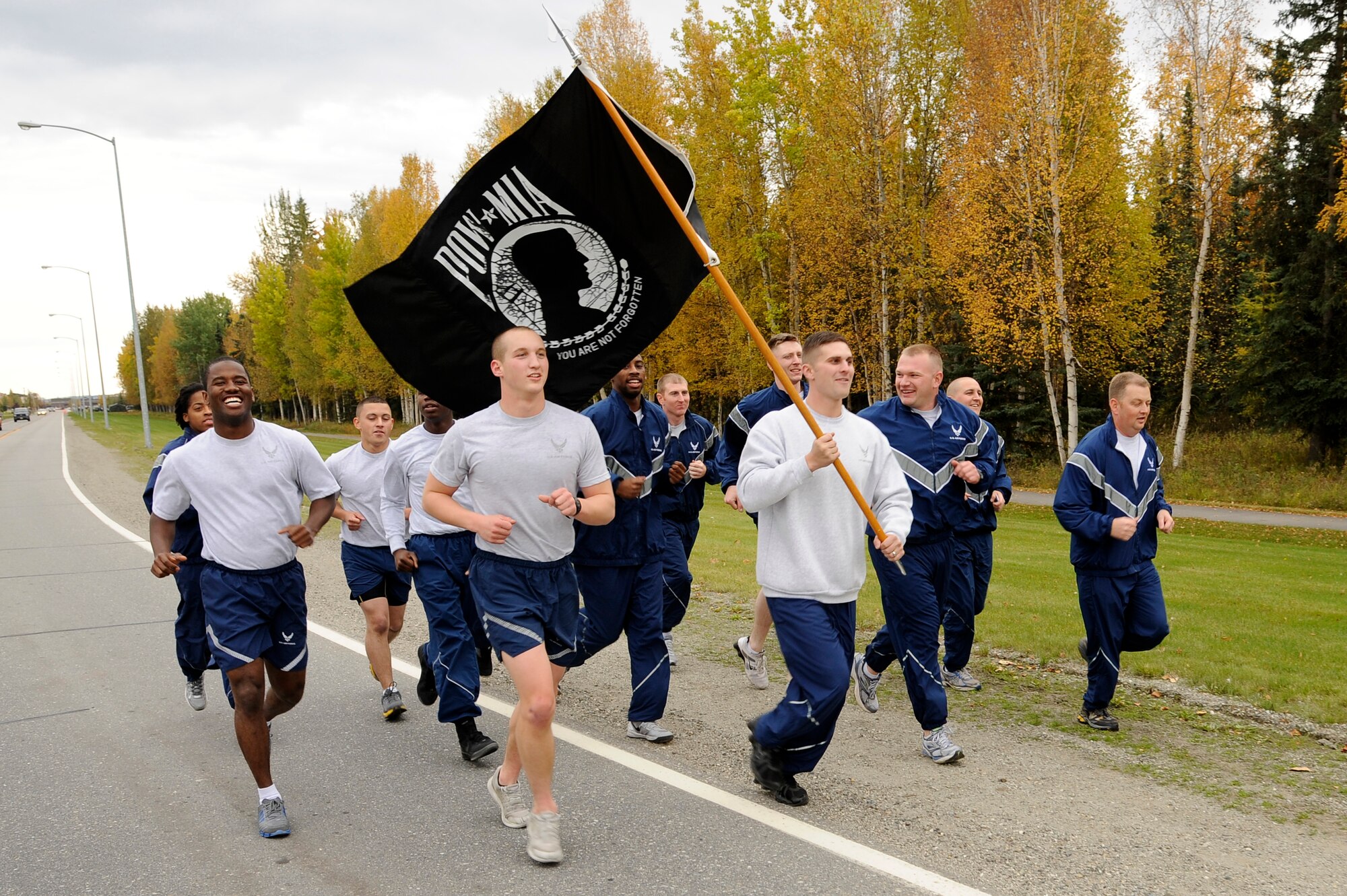 Members of Eielson Air Force Base run during the prisoner of war/missing in action remembrance run Sept. 14, 2012, Eielson AFB, Alaska. The run was held for 24 hours with the purpose of creating unity among squadrons, as well as raising awareness of the sacrifices for past service members.  (U.S. Air Force photo/Staff Sgt. Jim Araos)