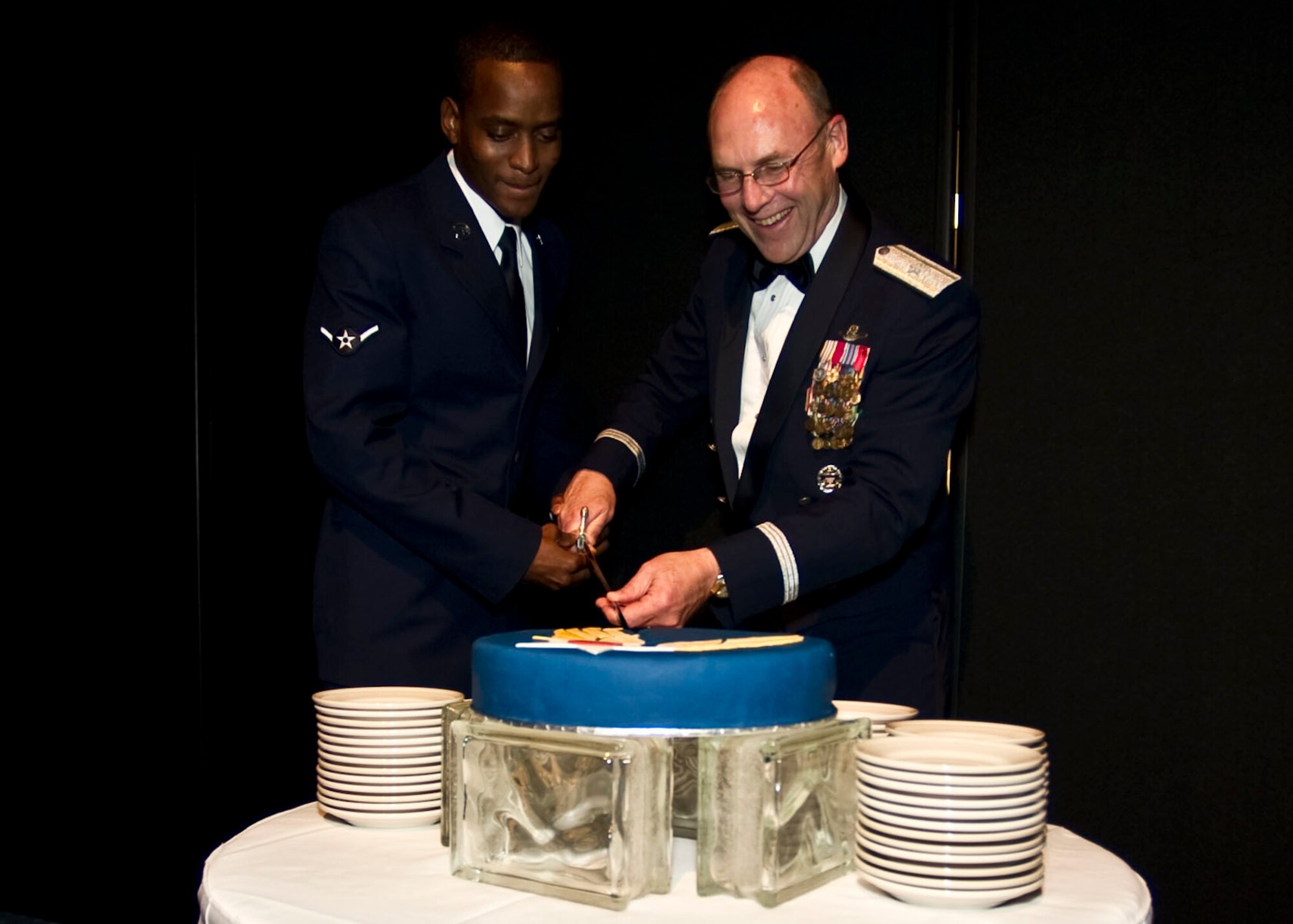 Brig. Gen. Michael Kinglsey, vice commander of Air Force Special Operations Command, right, and Airman Rycardo Folkes, a services specialist of 1st Special Operations Force Support Squadron, cut a ceremonial cake at the inaugural Hurlburt Ball at the Emerald Coast Conference Center on Okaloosa Island, Fla., Sept. 14, 2012. Kingsley and Folkes were selected to serve in an Air Force tradition where the most senior- and junior-ranking active-duty Airmen in attendance cut the Air Force's birthday cake. (U.S. Air Force photo / Tech. Sgt. Vanessa Valentine)