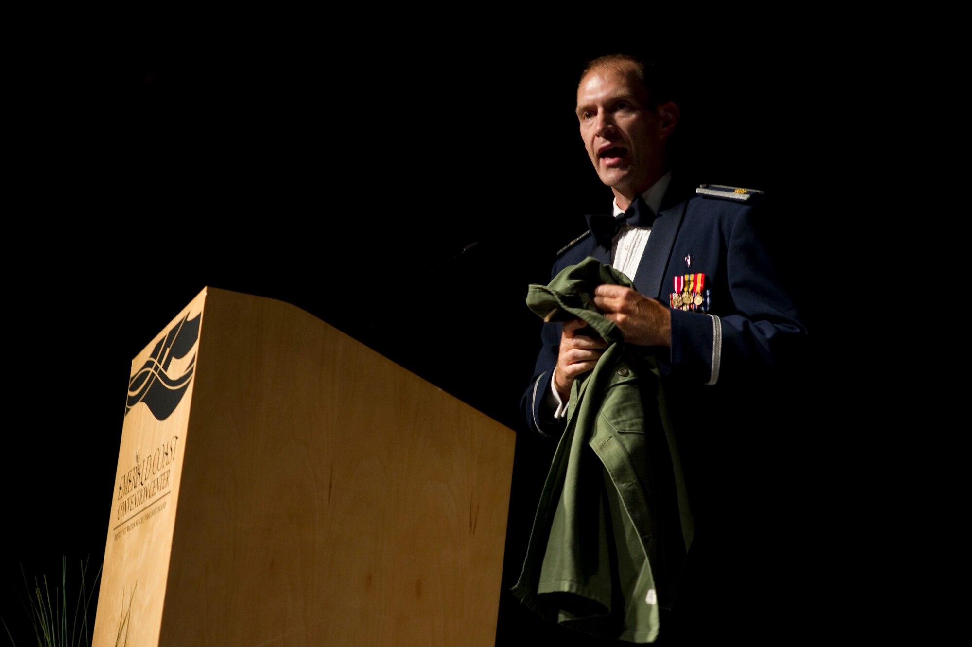 U.S. Air Force Chaplain Jonathan Hurt, 1st Special Operations Wing, holds up a pair of his grandfather's U.S. Army fatigues before his invocation at the inaugural Hurlburt Ball at the Emerald Coast Conference Center on Okaloosa Island, Fla., Sept. 14, 2012. Hurt's invocation echoed the ball's theme "Reflecting on our Past, Sustaining our Future.' (U.S. Air Force photo / Tech. Sgt. Vanessa Valentine)