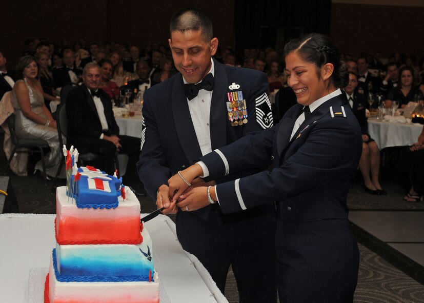 U.S. Air Force Chief Master Sgt. Roger Shaw, 7th Mission Support Group, left, and 2nd Lt. Christina Salinas, 7th Equipment Maintenance Squadron, cut the ceremonial cake during the annual Air Force Ball Sept. 14, 2012, at the Civic Center in Abilene, Texas. Dyess celebrated the Air Force’s 65th anniversary with the Air Force Ball. (U.S. Air Force photo by Airman 1st Class Peter Thompson/ Released)