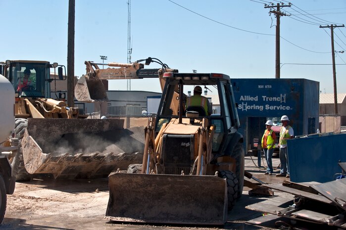 Michelle Hanks, N.D. Excavating Co. quality control, and George Canapa, N.D. Excavating Co. superintendent, oversee construction operations on Tyndall Avenue Sept. 17, 2012, at Nellis Air Force Base, Nev. A small segment of Tyndall Avenue will be closed for construction from Sept. 17 through Oct. 5. Utilities will be installed into a new hangar facility during this time. (U.S. Air Force photo by Staff Sgt. Christopher Hubenthal)