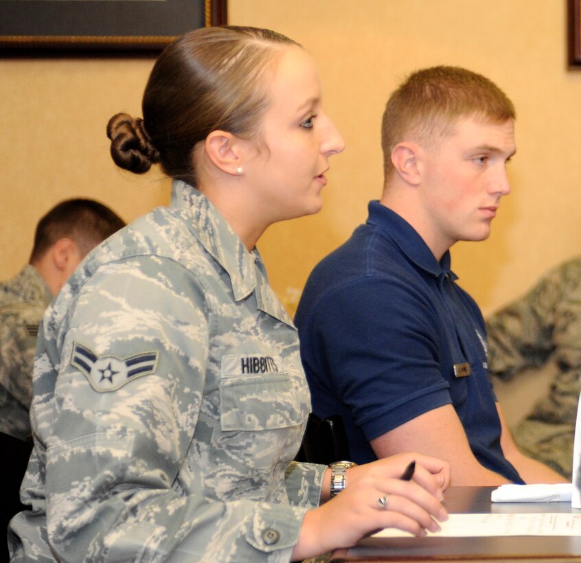 Airman 1st Class Leslie Hibbitts, 28th Contracting Squadron contract administrator, and A1C Austin Payne, 28th Force Support Squadron fitness specialist, brief Airmen about upcoming projects during the Active Airman's Council meeting at the Dakota's Club on Ellsworth Air Force Base, S.D., Sept. 14, 2012. The meetings, open to airmen basic through senior airmen, occur on the second Friday of every month to allow Airmen to discuss topics for fundraisers, outings and other quality of life concerns. (U.S. Air Force photo by Airman Ashley J. Woolridge/Released)