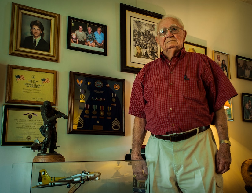 Jim Gatch, 89-year-old Army Air Corps veteran and World War II Prisoner-of-War, stands beside his military medals and a small-scaled replica of the B-17 Flying Fortress, for a photograph Sept. 10, 2012, at his home in Summerville, S.C. On May 12, 1944, while assigned to the 379th Bomb Group, Gatch was a base gunner on a B-17 aircraft that was shot down by the Germans.. He was captured by the enemy and remained a POW for 358 days. On September 21, Gatch will be in attendance with other surviving Lowcountry POWs in observance of the National POW/MIA Recognition Day.  (U.S. Air Force photo / Airman 1st Class Tom Brading)