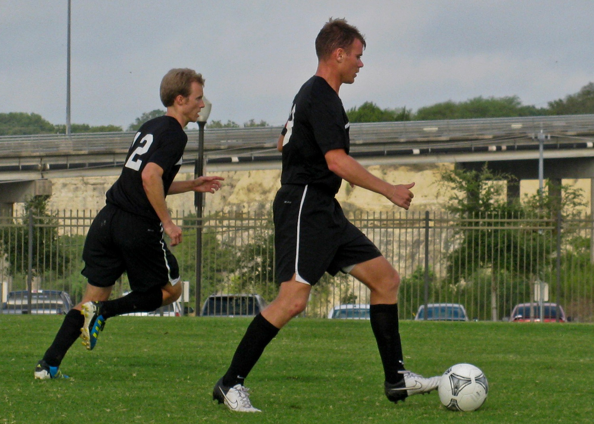 Eglin Air Force Base soccer team member Kevin Rosser dribbles the ball downfield while teammate Jeff Gibson runs in support, in the semifinal game against Kirtland AFB Sept. 3.  Eglin beat Kirtland 2-0. Eglin won the Defender’s Cup soccer tournament with a 2-1 win over Fort Bliss, Texas in the championship game.  (Courtesy photo)
