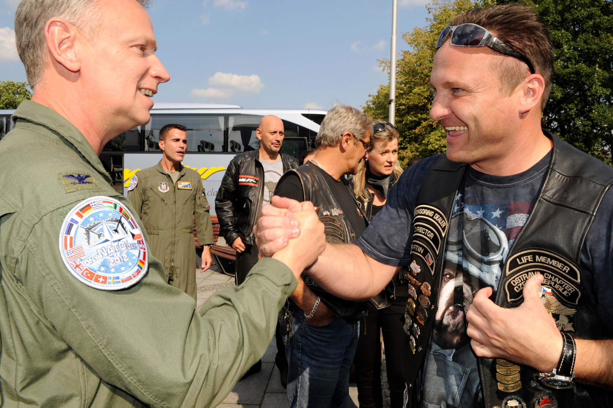 Col. Joseph Jones, who is the 307th Bomb Wing vice commander presents a flag pen to a local Harley rider. The Ostrava Harley Club escorted B-52 Stratofortress crewmembers to their hotel after they arrived in the Czech Republic, Sept. 18, 2012. Two B-52 Stratofortresses from Barksdale Air Force Base, La., are in Ostrava for the annual NATO Days Air Show scheduled for Sept 22-23. This is the third year for the 307 BW to support this air show. (U.S. Air Force photo by Senior Master Sgt Jessica Daurizio/Released)