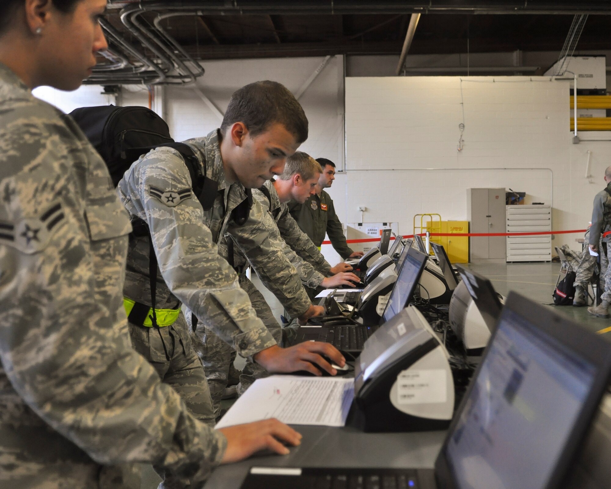 Airmen process through the finance line upon return from an operational readiness exercise, Sept. 13, 2012 at Joint Base Lewis-McChord. The fly-away exercise took place at Volk Field, Wis., as a preperation for the upcoming operational readiness inspection. (U.S. Air Force photo/Staff Sgt. Sean Tobin)