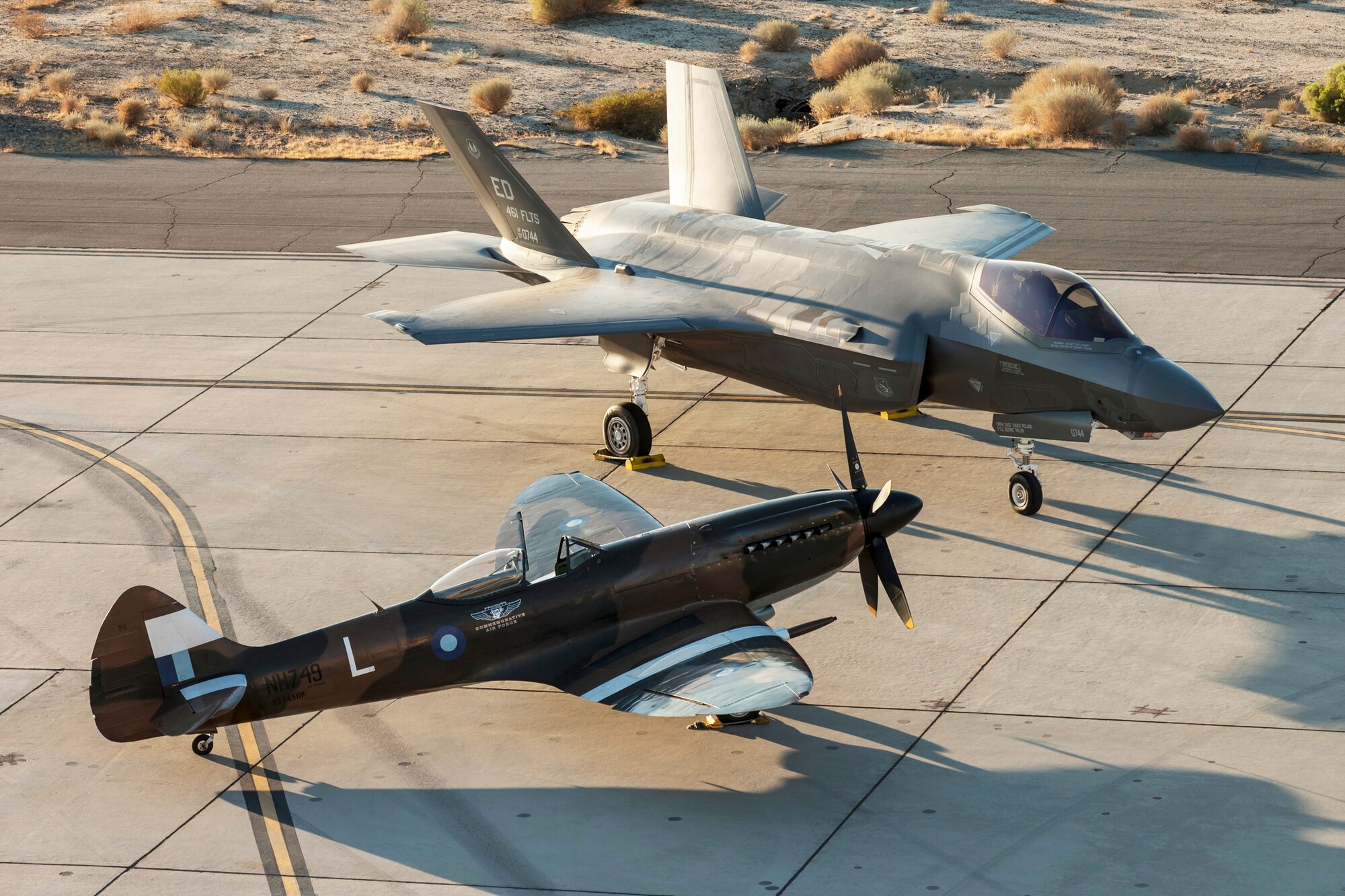 A Supermarine Spitfire parked next to F-35 AF-6 at the 461st Flight Test Squadron, Sept. 14. (Photo by Matthew Short/Lockheed Martin)