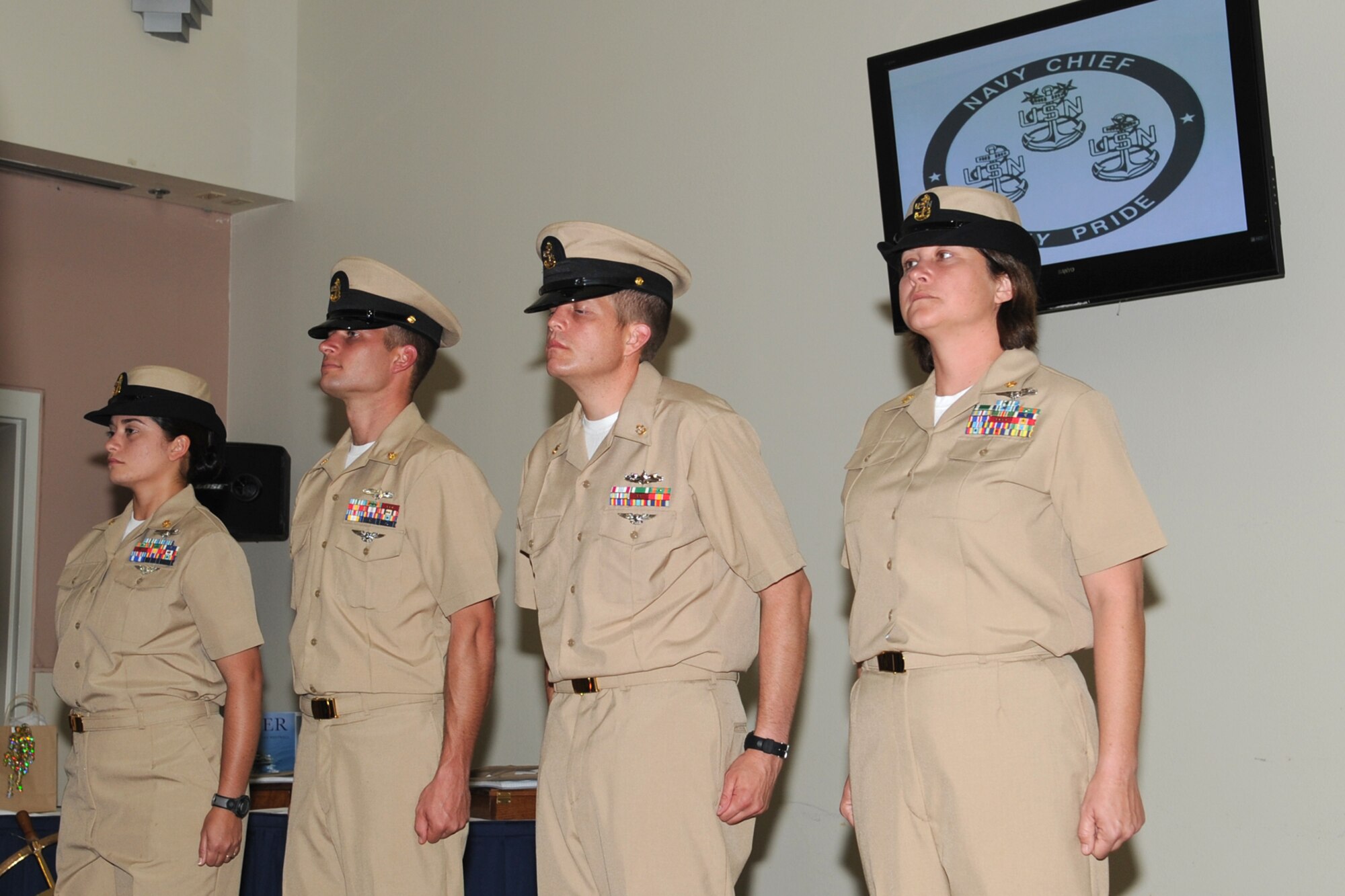 U.S. Navy Chief Petty Officers' Katriana Negron, Ryan Oktela, Trever Logan, and Robyn Tyler form up during the Center for Information Dominance Detachment Goodfellow’s chief petty officers pinning ceremony at Goodfellow Air Force Base, Texas, Sept. 14, 2012. The pinning ceremony was the culmination of a six-week induction process. (U.S. Air Force photo/Staff Sgt. Laura R. McFarlane)