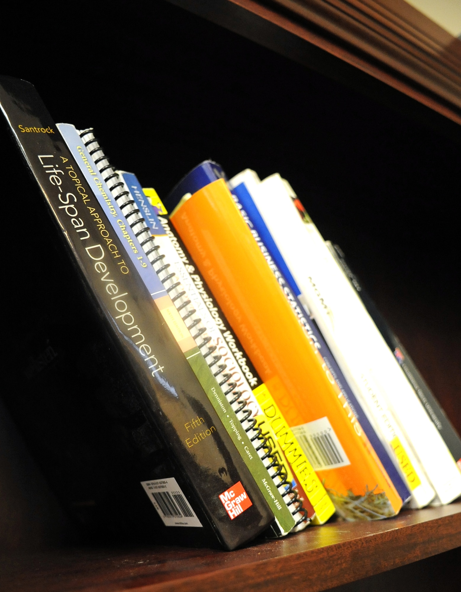 College textbooks wait to be checked out by Airmen at Barksdale Air Force Base, La., Sept. 17. These books are part of the books to borrow program created by Master Sgt. Scott Schreck, 2nd Maintenance Squadron Fabrication Flight assistant flight chief, to assist Airmen taking classes by eliminating the need to purchase a new or used book.  (U.S. Air Force photo/Senior Airman Micaiah Anthony)(RELEASED)