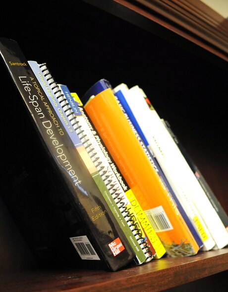 College textbooks wait to be checked out by Airmen at Barksdale Air Force Base, La., Sept. 17. These books are part of the books to borrow program created by Master Sgt. Scott Schreck, 2nd Maintenance Squadron Fabrication Flight assistant flight chief, to assist Airmen taking classes by eliminating the need to purchase a new or used book.  (U.S. Air Force photo/Senior Airman Micaiah Anthony)(RELEASED)
