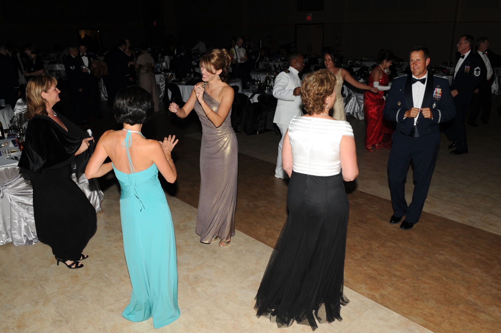 Attendees take to the dance floor to music performed by the Air Force Band of the West during the Goodfellow Air Force Base annual Air Force Ball Sept. 14 at the McNease Convention Center, San Angelo, Texas. The ball was a celebration of the Air Force’s 65th birthday, Sept. 18. (U.S. Air Force photo/Staff Sgt. Laura R. McFarlane)