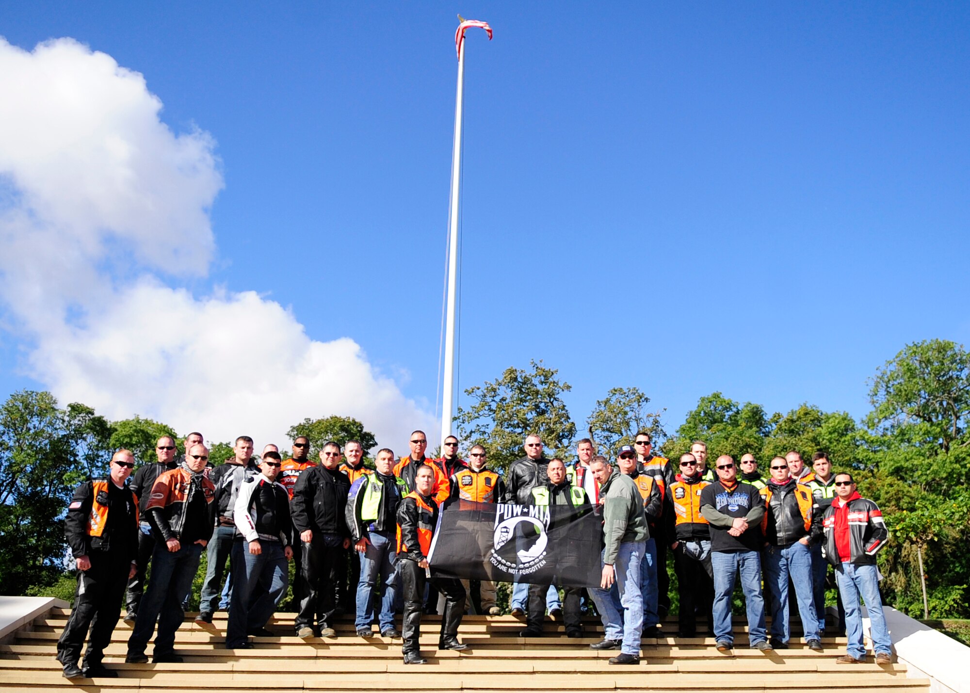 RAF MILDENHALL, England – Participants of the joint RAF Mildenhall and RAF Lakenheath Rolling Thunder motorcycle rally pose for a photo after laying a wreath at Madingley American Cemetery in Cambridge Sept. 18, 2012. The riders went to eight locations including Mildenhall, Newmarket, Bury St. Edmunds, Lakenheath, Diss and Mundford to honor those still unaccounted for by placing wreathes at various memorials and cemeteries. (U.S. Air Force photo/Senior Airman Ethan Morgan) 