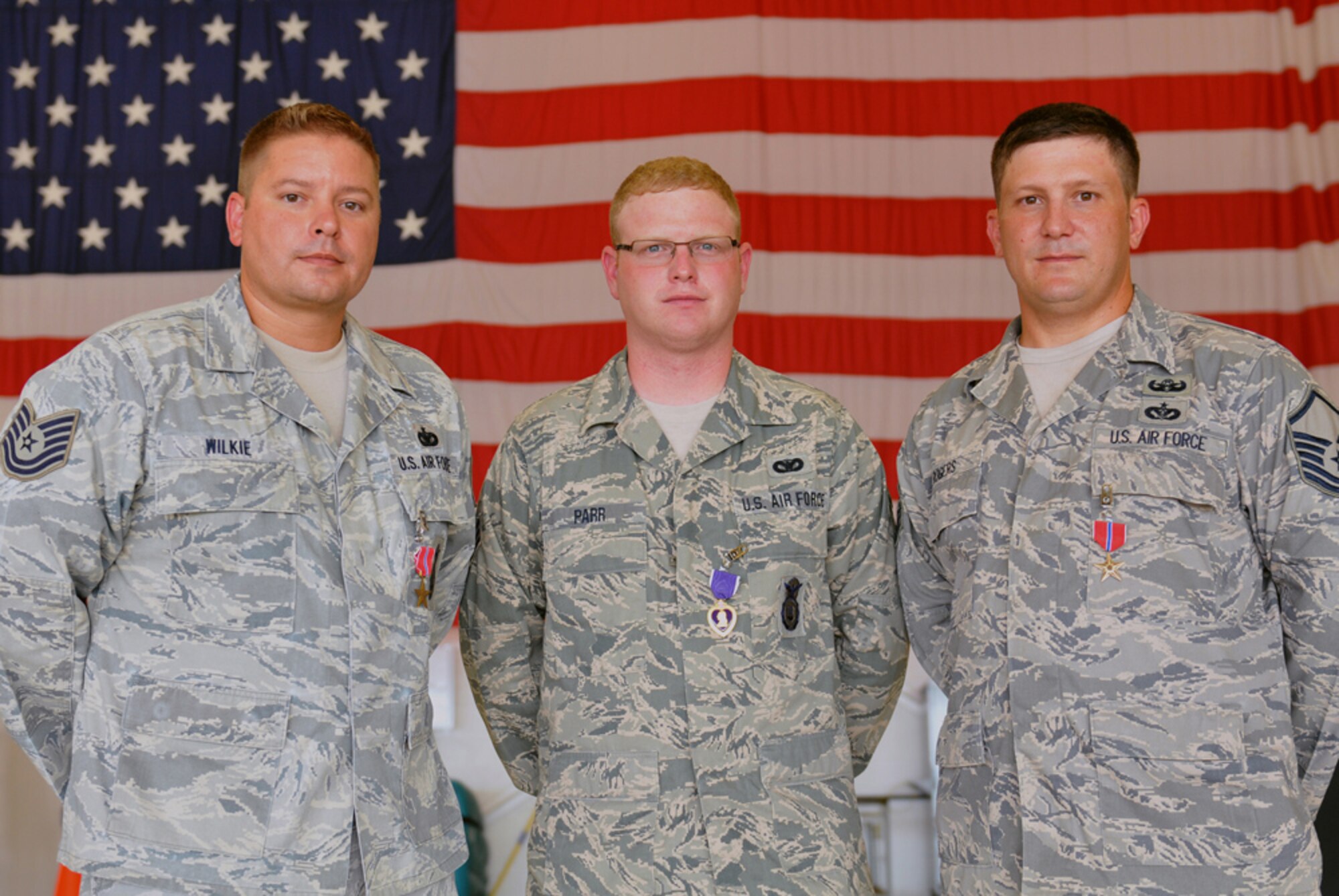 (left to right) Bronze Star recipient Technical Sgt. Charles Wilkie Jr., Purple Heart recipient Senior Airman Sean Parr, and Bronze Star recipient Master Sgt. Raleigh Rogers, stand for a photo following an awards ceremony in their honor, August 19, 2012, 125th Fighter Wing, Florida Air National Guard, Jacksonville, Fla. (Air National Guard photo by Master Sgt. Shelley Gill)