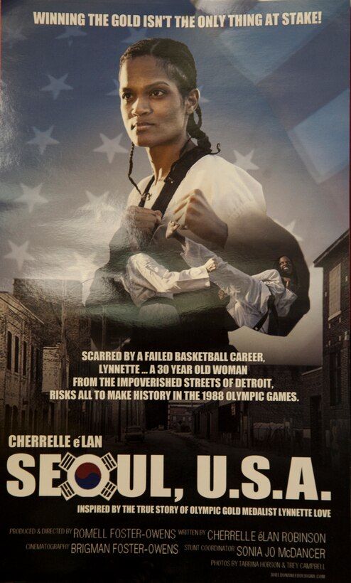 Actress and  screen writer Cherrelle e'Lan portrays Lynnette Love on the "Seoul, U.S.A." movie poster hanging in the Love Tae Kwon Do Academy at the Joint Base Andrews Youth Center. (Photo/Bobby Jones)