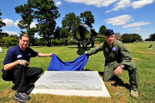 Thomas Mitchell, U.S. Air Force Staff Sgt., 77th Aircraft Maintenance Unit crew chief retired (left), and Col. Lance Kildron, 20th Fighter Wing vice commander unveil the F-111E dedication stone, Sept. 12, 2012, Shaw Air Force Base, S.C. Kildron and the 20th Fighter Wing held a dedication ceremony, dedicating the F-111E to the men and women of the 20th Fighter Wing who flew and maintained the aircraft. The F-111E is a significant part of the 20th Fighter Wing’s history as it was first flown as a part of the wings arsenal in 1970. Aircraft 68-0035 and 680045 landed at Royal Air Force Upper Heyford 42 years ago, starting a new era for the wing. (U.S. Air Force photo by Senior Airman Kenny Holston/Released) 