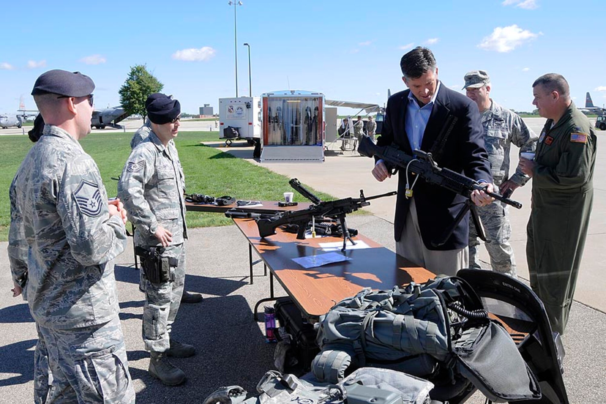Illinois State Senator Darin LaHood handles a rifle at a Security Forces static display at the 182d Airlift Wing in Peoria, Ill. on Sep. 8, 2012. (U.S. Air Force photo by Tech Sgt. Todd Pendleton/Released).
