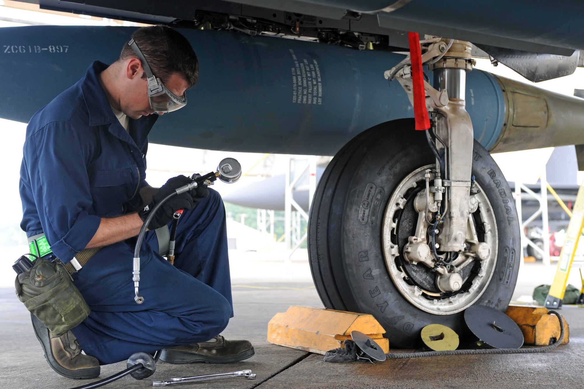 U.S. Air Force Senior Airman Andrew Hillis, 335th Aircraft Maintenance Unit, prepares to inspect an aircraft tire’s air pressure during Operational Readiness Exercise Coronet Warrior 12-4 on Seymour Johnson Air Force Base, N.C., Sept. 17, 2012. During phase I of the exercise, maintainers prepared aircraft for launch to a simulated, deployed location. (U.S. Air Force photo/Airman 1st Class John Nieves Camacho/Released)